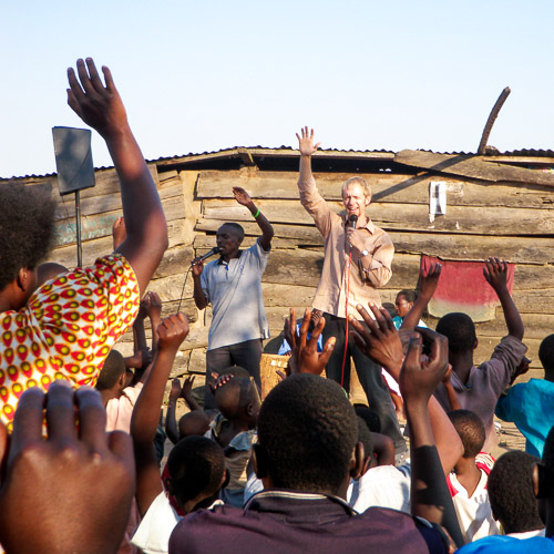 Brent Earwicker preaches at an open air event on Bunjako Island, Lake Victoria, Uganda.